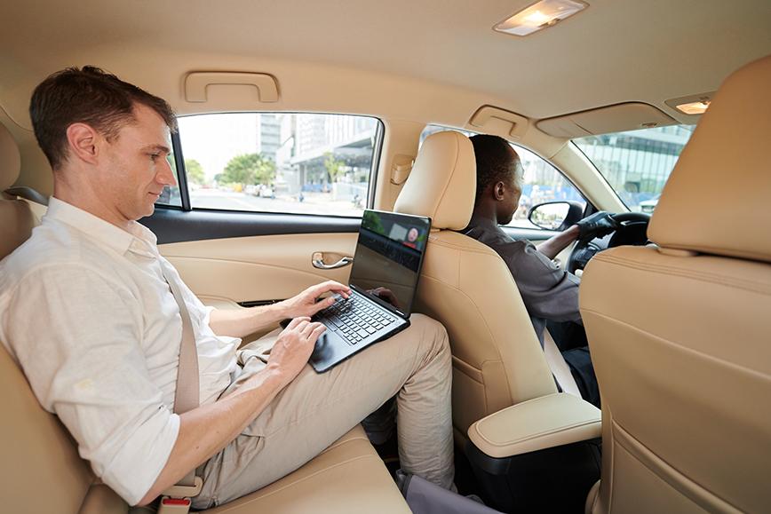 guy-with-a-laptop-in-a-car